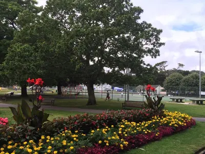 a park with a bunch of flowers in the grass at The Apartment Boscawen Woods in Truro