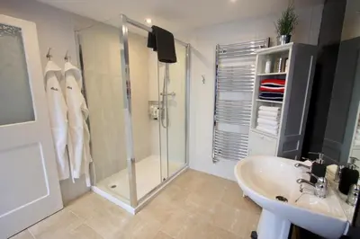 a bathroom with a shower and a sink at 'the inlet' falmouth in Falmouth