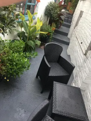 a patio with two chairs and a table and a chair at 'the inlet' falmouth in Falmouth