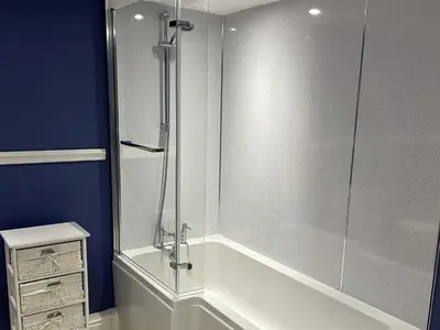 a shower with a glass door in a bathroom at Moor View in Delabole