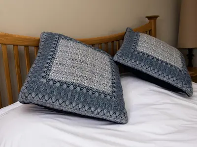 two pillows sitting on top of a bed at Rosecott in St Ives
