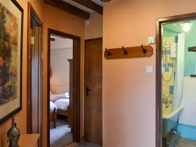 a room with a hallway with a door and a bedroom at Provence-Uk12747 in Menheniot