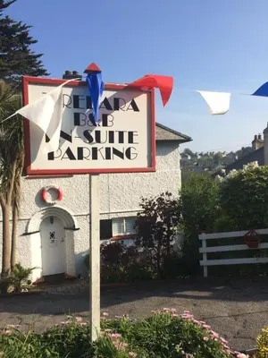 a sign for a baja sun strip bartering at Tredara Bed & Breakfast in Truro