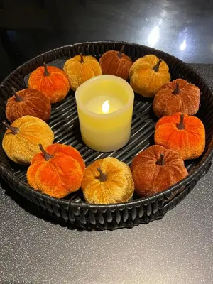 a tray with a candle and a bunch of pumpkins at Hooters Apartment EV Point in Wadebridge