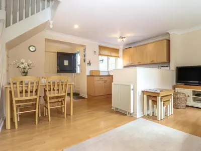 a kitchen and dining room with a table and chairs at Deja Blue in Falmouth