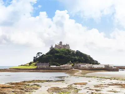 a castle on top of an island in the ocean at Maple in Truro