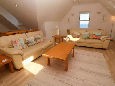 a living room with a couch and a table at Meridian in St Ives