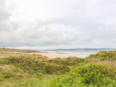 a view of a beach with the ocean in the background at Coth Skyber in Hayle