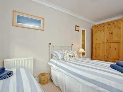 a bedroom with two beds in a room at Chyandour in Fowey