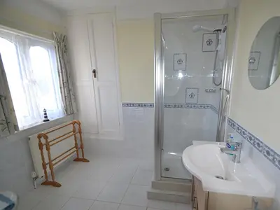 a bathroom with a shower and a sink at Riverview in Fowey