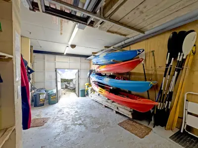 a room with kayaks hanging on the wall at Lower Deck in Fowey