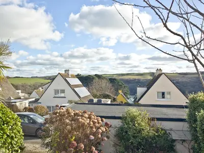 a view of a village with houses and cars at The Lodge in Fowey