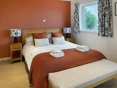 a bedroom with two beds with towels on them at The Lodge in Fowey
