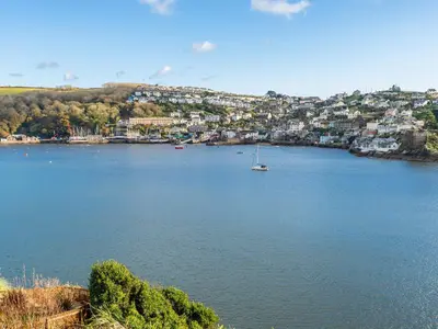 a large body of water with a boat in it at Bosula in Fowey