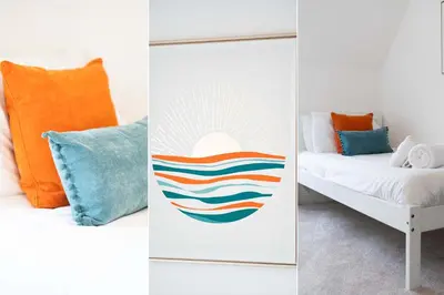 a bedroom with colorful pillows and a bed at Merlins in Hayle