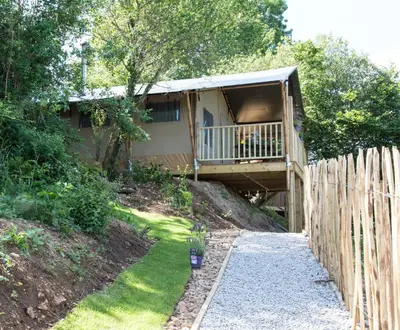 a house with a deck and a fence at Trengilly Wartha Inn in Constantine