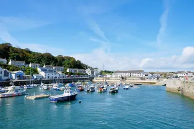 a bunch of boats are docked in a harbor at Finest Retreats - Luxury Holiday Let in Porthleven, Sleeping 2 in Porthleven