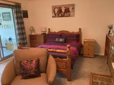 a bedroom with a bed and a couch at Travellers Rest in Launceston