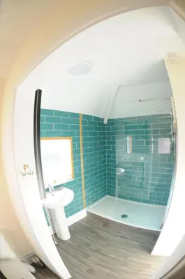 a bathroom with a sink and a shower at Victoria Inn in Penzance