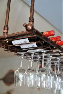 a bunch of wine glasses hanging from a rack at Molesworth Arms in Wadebridge