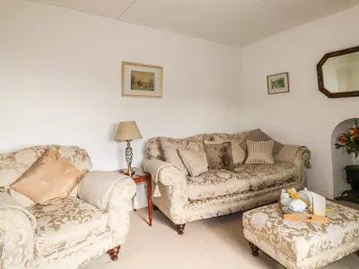 a living room with two couches and a couch at Penrose Farm Cottage in Saint Keverne