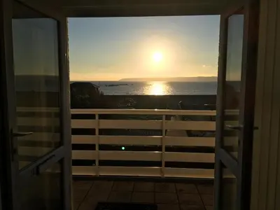 a view of the ocean from the door of a balcony at Sea Breeze in Marazion