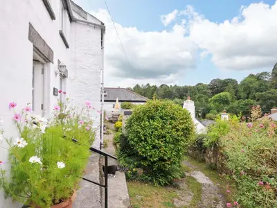 a view from the balcony of a house with flowers at Little Hamlin in Callington
