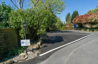 a parking lot with a sign that says my driveway at Ivy House Cornwall B&B in St Austell