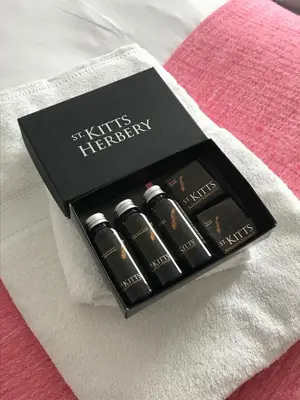 a black box of lipstick sitting on a bed at 19 Ocean Gate in Newquay