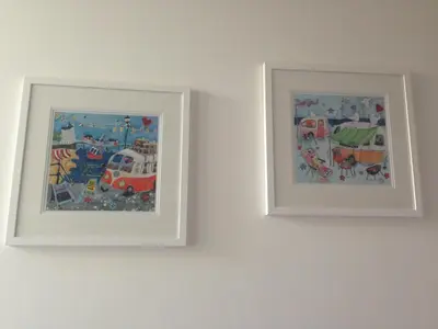 two framed pictures on a wall in a room at Westward B&B in Newquay