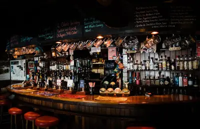 a bar with a lot of bottles of alcohol at Driftwood Spars in St. Agnes