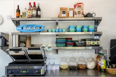 a refrigerator filled with lots of food and drinks at Driftwood Spars in St. Agnes