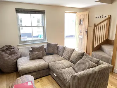 a living room with a couch and a chair at Harrys Hideout in St Ives