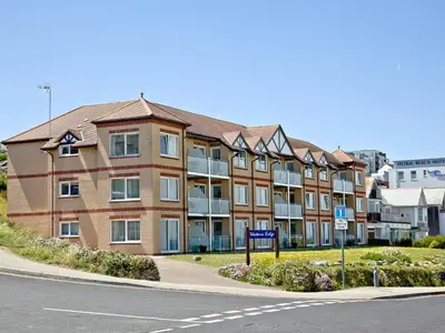 an apartment building on the corner of a street at Apartment 8 in Newquay