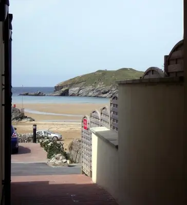 a view of a beach from a building at The Beach House & Porth Sands Apartments in Newquay