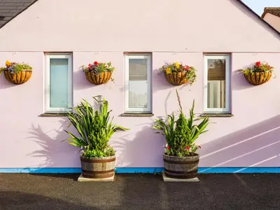a house with flower pots on the side of it at Nectan in St Austell