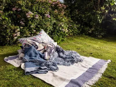 a blanket laying on the grass on a field at Nectan in St Austell