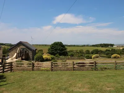 a wooden fence in front of a house at Oak Cottage in Truro