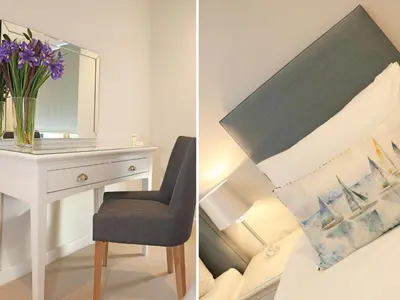 a bedroom with a desk and a chair and a mirror at Little Fistral in Newquay