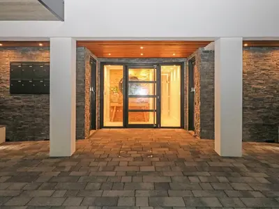 an entrance to a building with a glass door at Little Fistral in Newquay