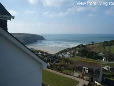a view of the ocean from a house at Seagulls Perch in Mawgan Porth