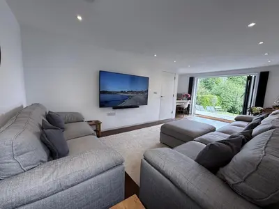 a living room with two couches and a flat screen tv at No.10 Falmouth - 2 minutes walk to the beach in Falmouth