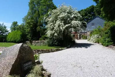 a gravel driveway in front of a house at Church Close Cottage in Gwennap