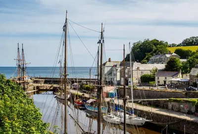 a group of boats docked in a harbor at Church Close Cottage in Gwennap
