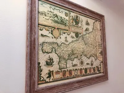 a framed map of the world on a wall at Bay House Lundy Port Isaac Apartment with Sea Views & Parking in Port Isaac