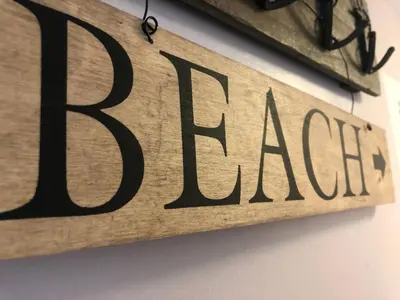 a sign that reads race hanging on a wall at Bay House Lobber Port Isaac Apartment with Sea Views & Parking in Port Isaac