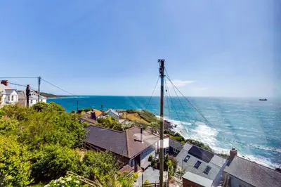 a view of the ocean from a house at Dolphins in Coverack
