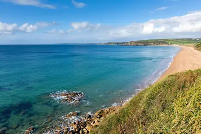 a view of the beach from the cliffs at Balwest Cottage in Helston