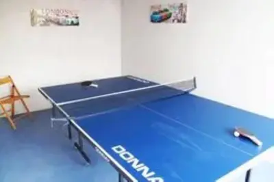 a ping pong table in a room with a ping pong ball at Skysail - Exceptional Sea Views in Mevagissey