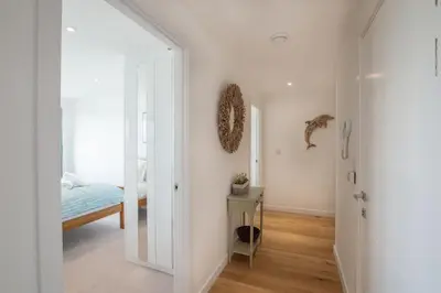 a hallway with a door leading to a bedroom at Harbour Lights in Newquay